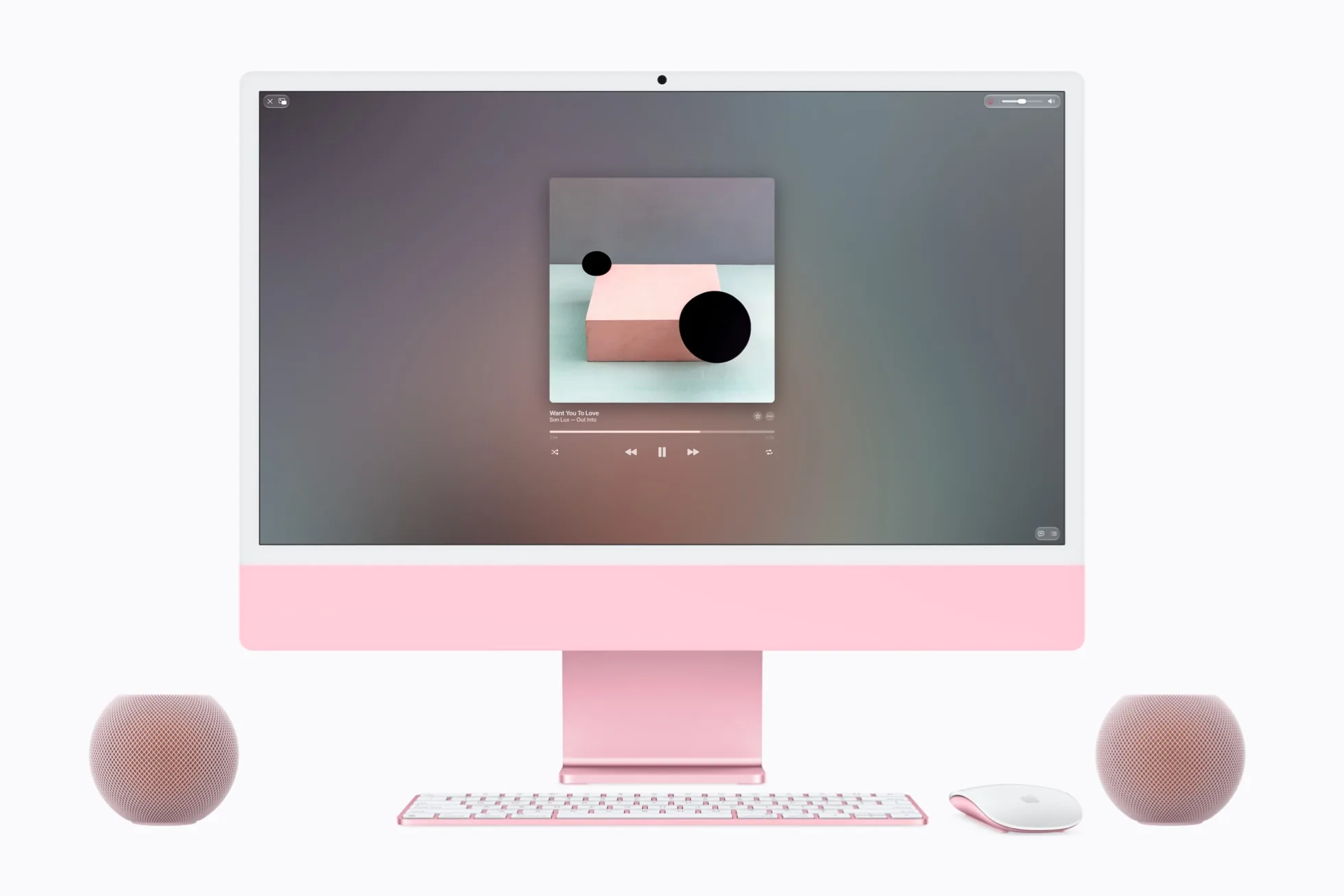 Two pink HomePod mini 2 speakers on either side of a pink iMac playing music