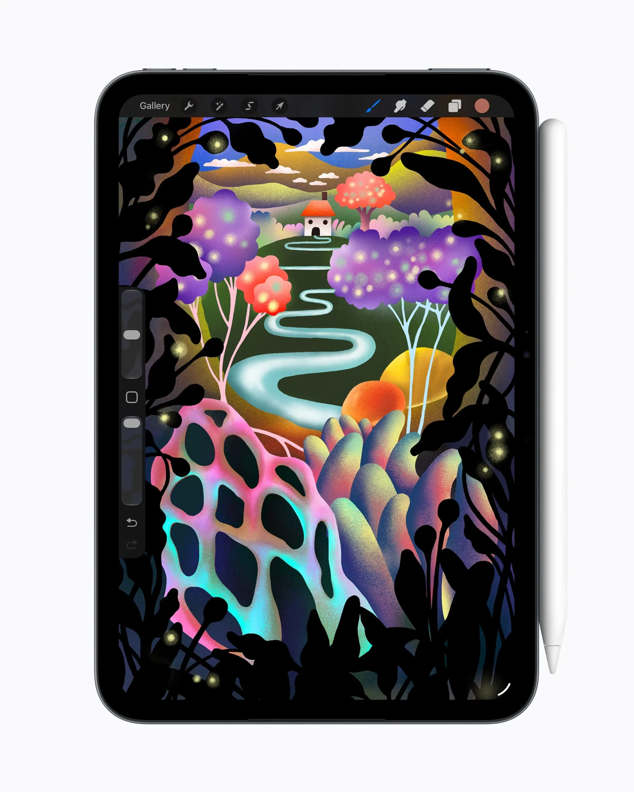 An iPad mini showing a colorful Procreate illustration of a winding path through a forest, with a white Apple Pencil Pro standing beside it