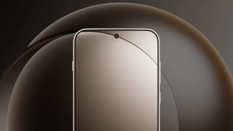 The front of a OnePlus 15 with a blank, softly lit screen and a hole-punch selfie camera, in front of a large dark bronze sphere