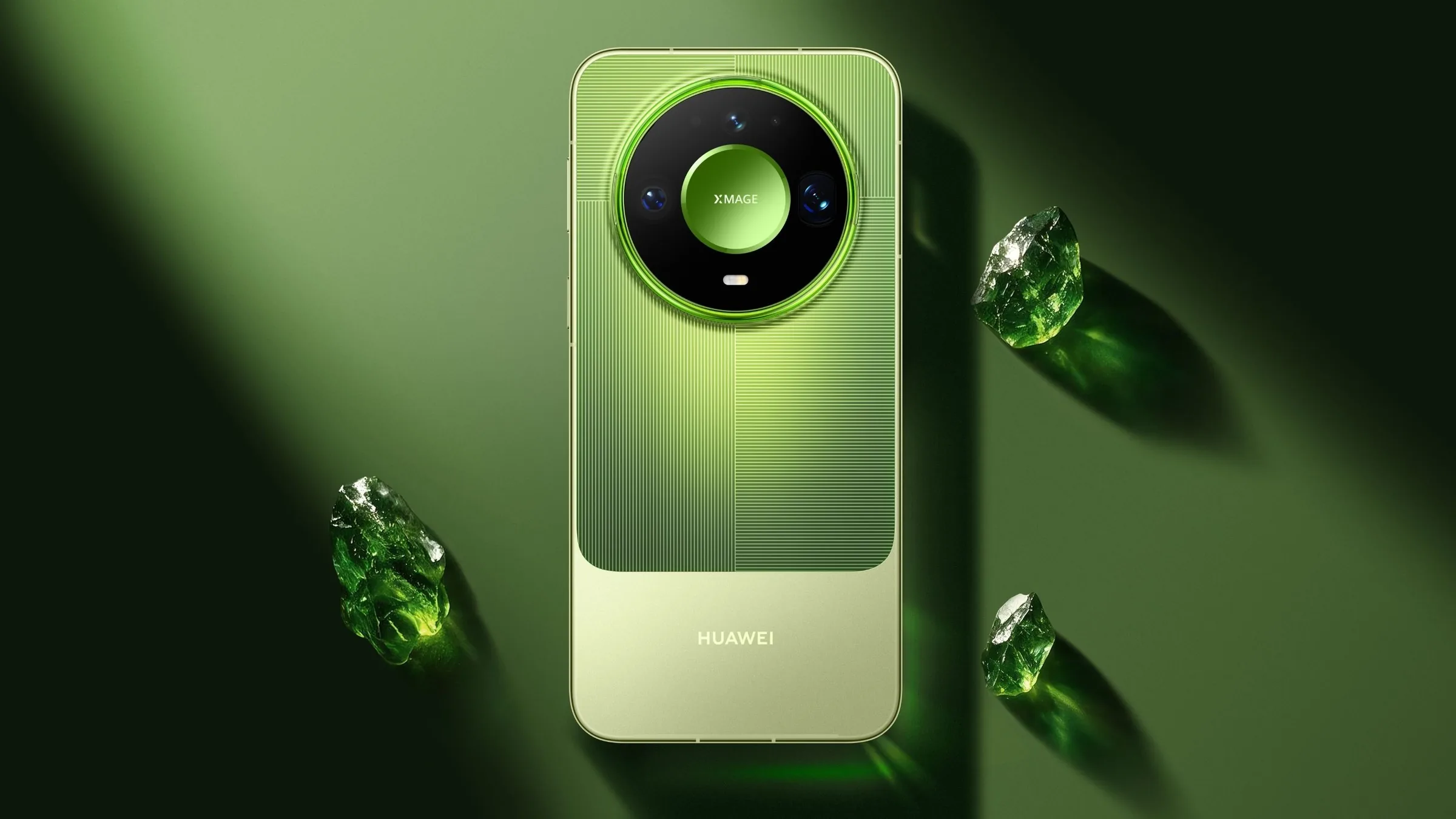 The back of a green Huawei Mate 90 Pro Max Collector's Edition with its round camera module, on a green surface beside green crystals